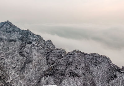 Low angle view of rock formation against sky