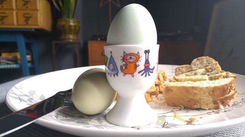 Close-up of eggs in plate on table