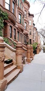 Residential buildings by street in city