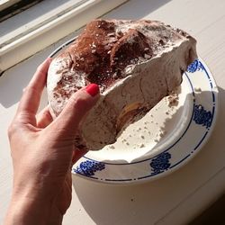 Cropped image of person holding ice cream