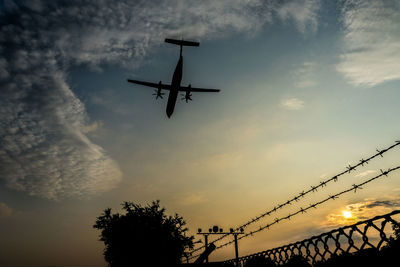 Low angle view of ferris wheel against sky