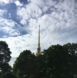 Low angle view of tower against cloudy sky