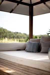 Empty chairs and table against window