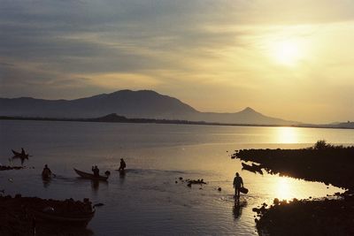Scenic view of lake against sky during sunset
