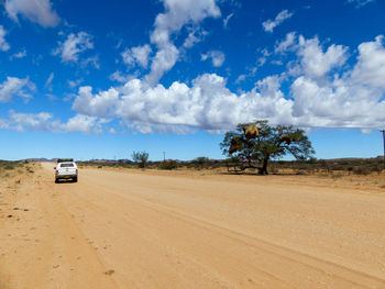 Cars on road against sky