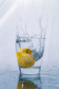 Close-up of water splashing in glass