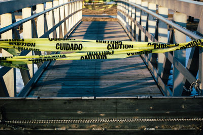 Caution tape on bridge