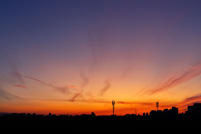 Silhouette landscape against romantic sky at sunset