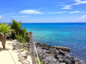 Scenic view of sea against blue sky