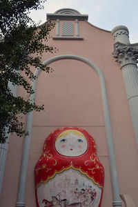 Low angle view of statue against building