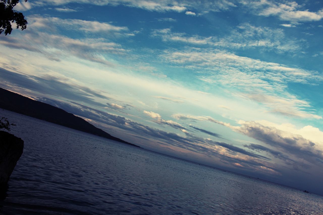 water, sea, sky, tranquil scene, scenics, tranquility, beauty in nature, cloud - sky, nature, horizon over water, idyllic, cloud, waterfront, beach, non-urban scene, rippled, outdoors, cloudy, mountain, blue