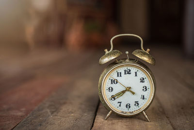 Close-up of clock on table