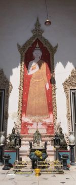 Low angle view of statue against temple