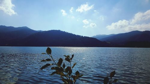 Scenic view of lake and mountains against sky