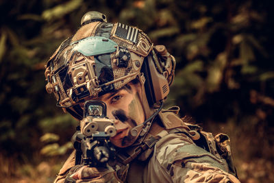 Portrait of man wearing mask against blurred background