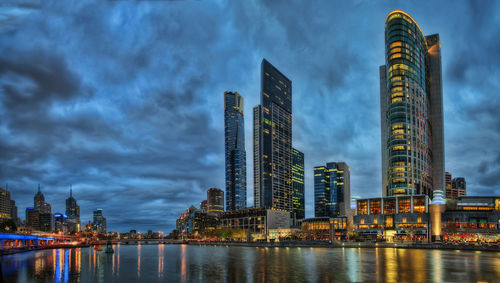 Panoramic view of city by buildings against sky