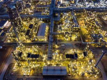 High angle view of illuminated factory at night