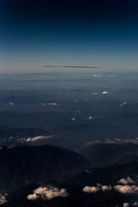 Scenic view of landscape seen through airplane window