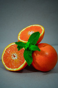 Close-up of orange fruit on white background