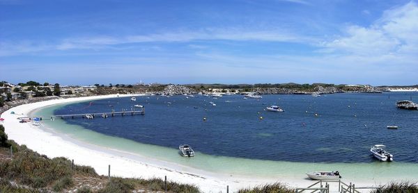 High angle view of people on shore against sky