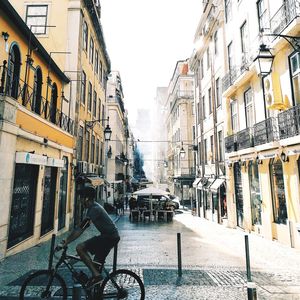 Street amidst buildings against sky