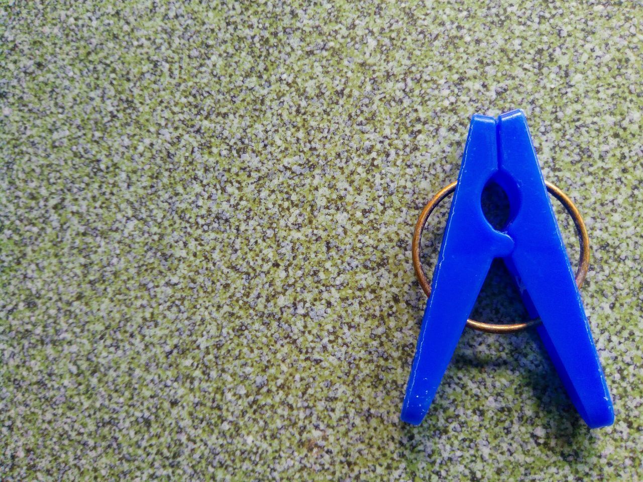 HIGH ANGLE VIEW OF TOY ON SAND