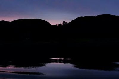 Scenic view of mountains at sunset