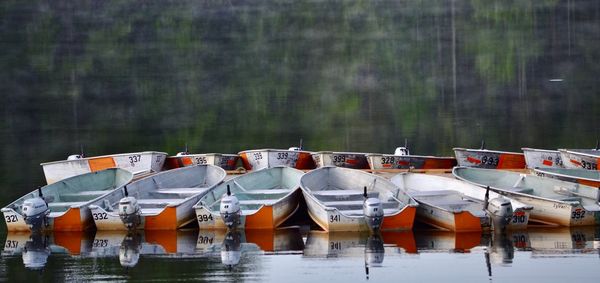 Boats moored in lake