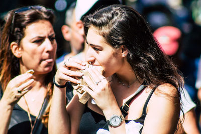 Portrait of young woman holding ice cream