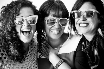 Happy female friends wearing sunglasses