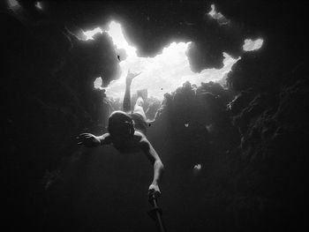 Low angle view of man snorkeling in sea