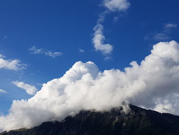 Low angle view of majestic mountains against sky