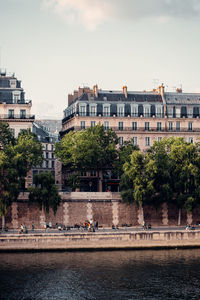 Buildings against sky with city in background