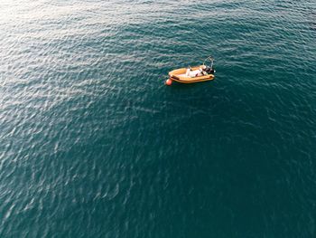 High angle view of people on boat in sea