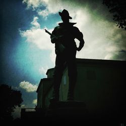 Low angle view of statue against sky