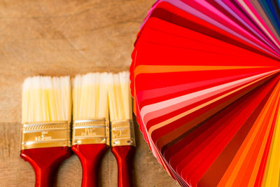 Close-up of multi colored umbrellas on table