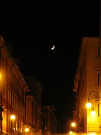 Low angle view of illuminated street light at night