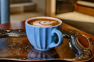 Close-up of coffee cup on table