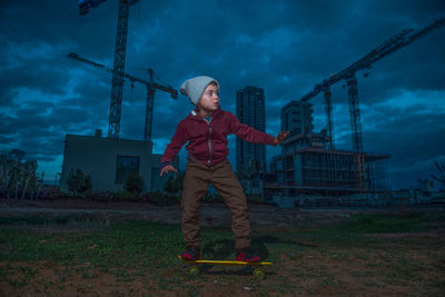 Full length of man standing against sky at dusk