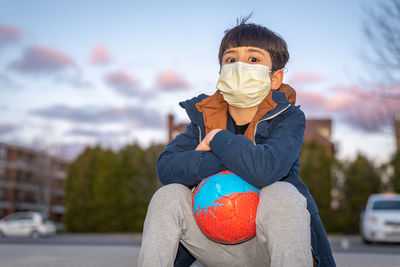 Portrait of boy wearing sunglasses against sky