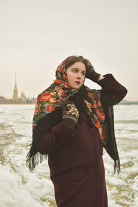 Full length of woman standing in snow