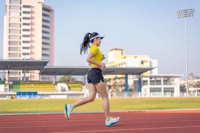 Full length of woman running