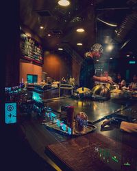 High angle view of illuminated food on table at restaurant