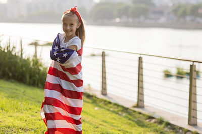 Young woman holding american flag