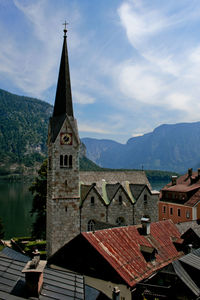 Buildings against mountain range