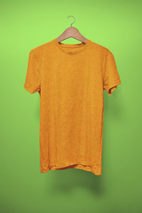 Close-up of clothes hanging on green background