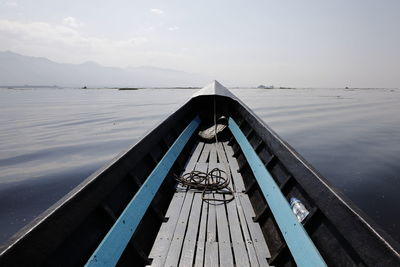 Boat sailing on sea against sky