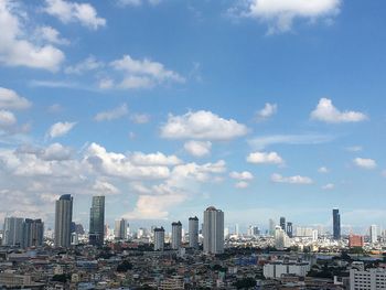 Modern buildings in city against sky