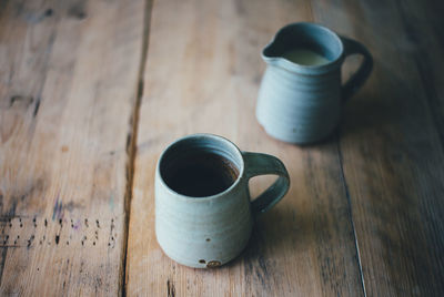 High angle view of coffee in mugs on table