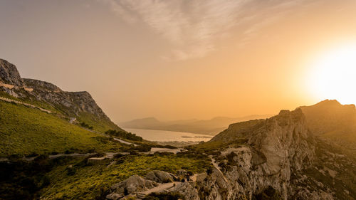 Scenic view of mountains against sky during sunset